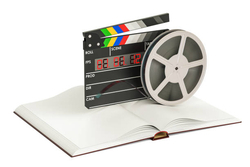 taśma filmowa stojąca na książce - wyniki ankiety czytelniczo-filmowej